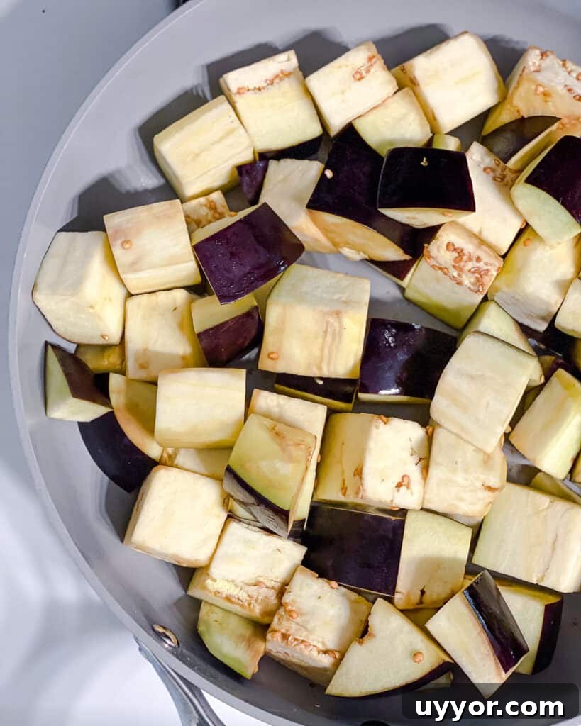 process shot of cooking eggplant in pan