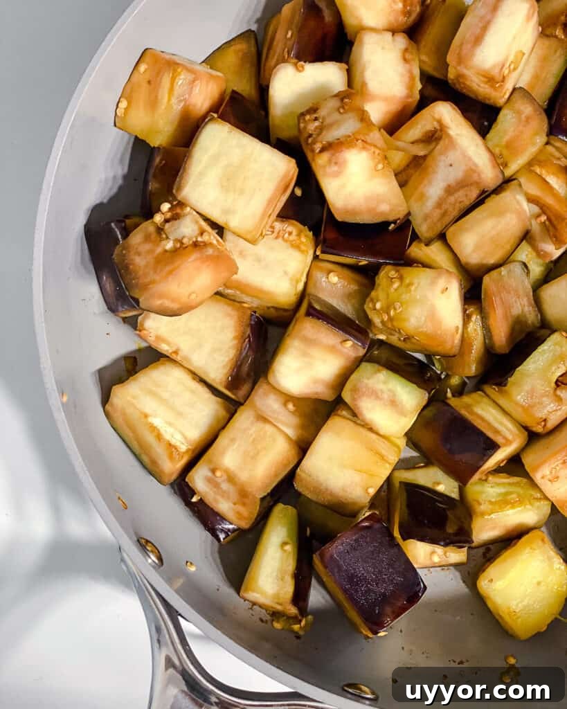 process shot of cooking eggplant in pan
