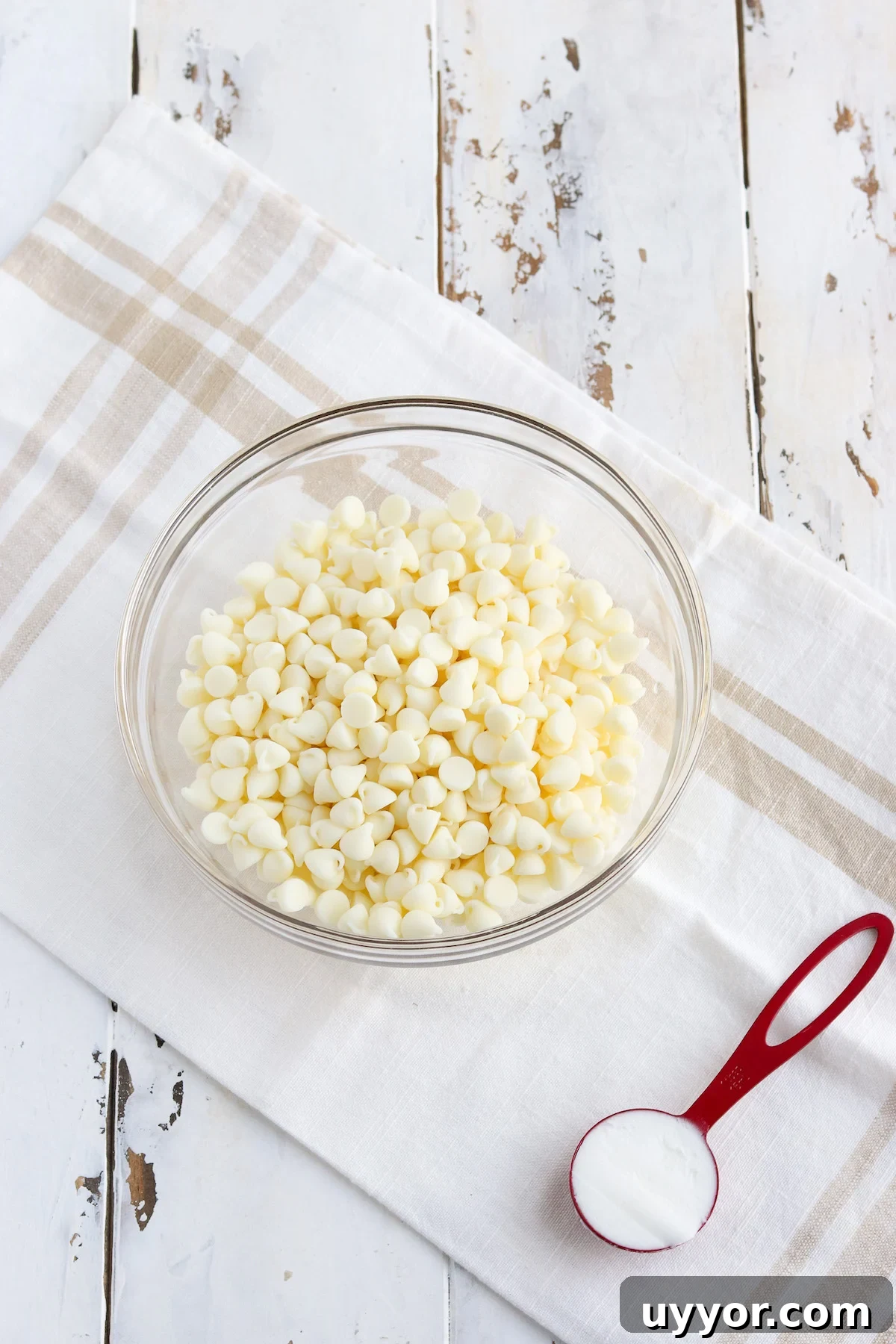 White Chocolate-Covered Strawberries: Simple Step-by-Step Recipe 5 Glass bowl of high quality white chocolate chips and one tablespoon of shortening preparing to melt.