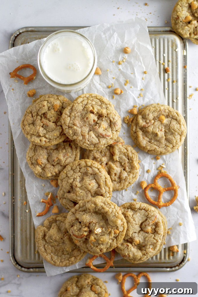 Butterscotch Pretzel Cookie Recipe: Sweet & Salty Treat 11 overhead look at butterscotch pretzel cookies and milk on parchment paper
