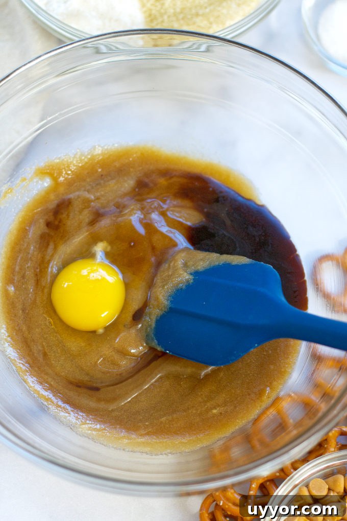Butterscotch Pretzel Cookie Recipe: Sweet & Salty Treat 5 egg, vinegar and vanilla being mixed into sugars and butter
