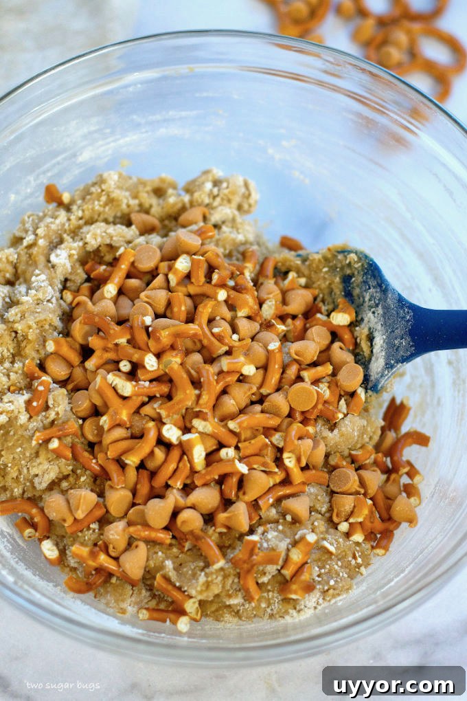 Butterscotch Pretzel Cookie Recipe: Sweet & Salty Treat 8 cookie dough with pretzels and butterscotch chips being mixed in