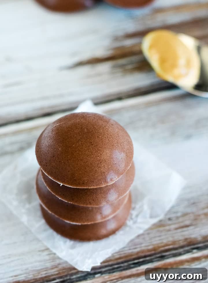 Keto chocolate peanut butter fat bombs with coconut oil and peanut butter overhead shot of chocolate fat bombs with coconut oil and peanut butter