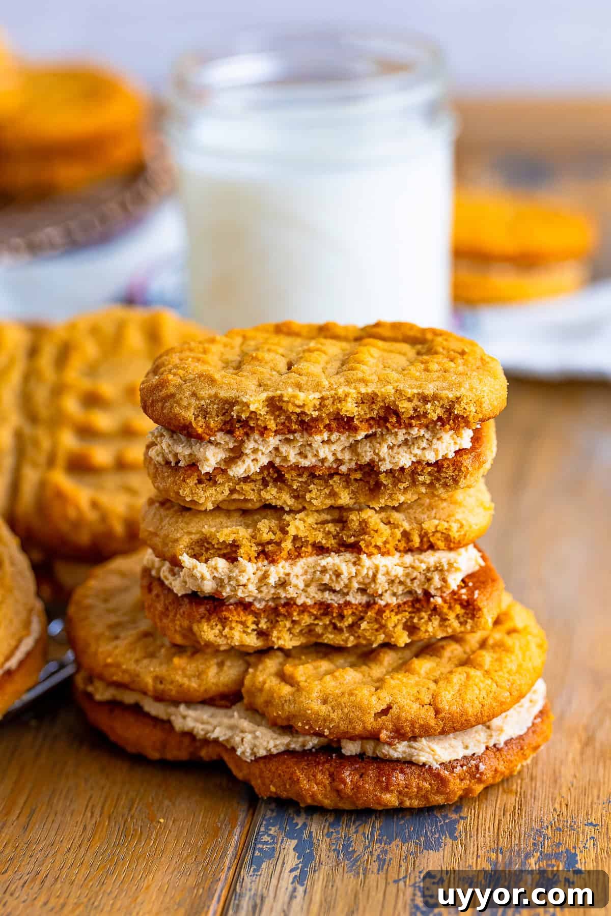 Homemade Nutter Butter Cookies: Chewy Peanut Butter Sandwich Cookies Recipe 8 Nutter Butter Cookies stacked on top of each other