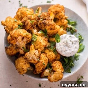These roasted cauliflower bites with a mint dip are a tasty vegetarian appetizer or side dish! Ready in 30 minutes.