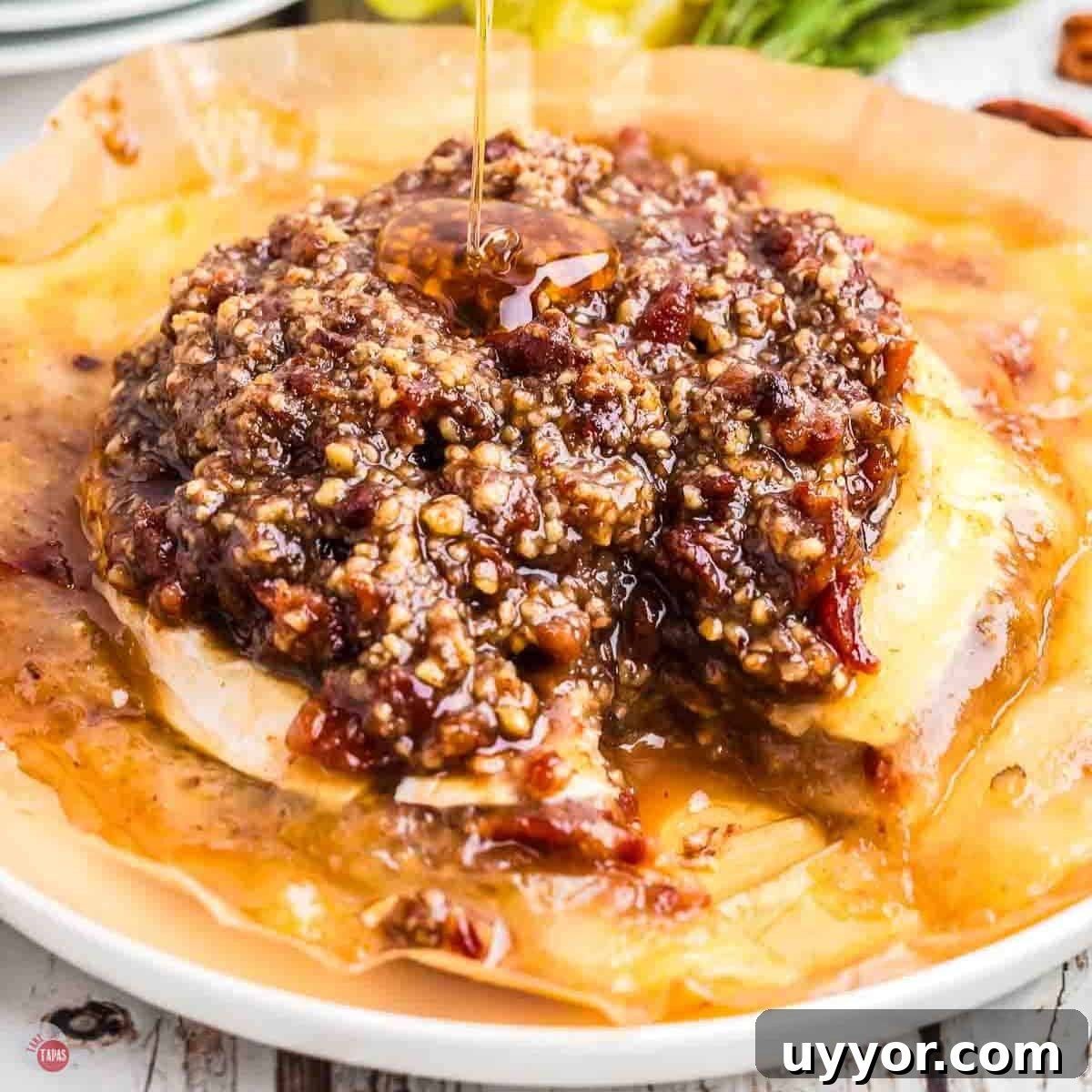 baked brie with pecan and bacon jam on top