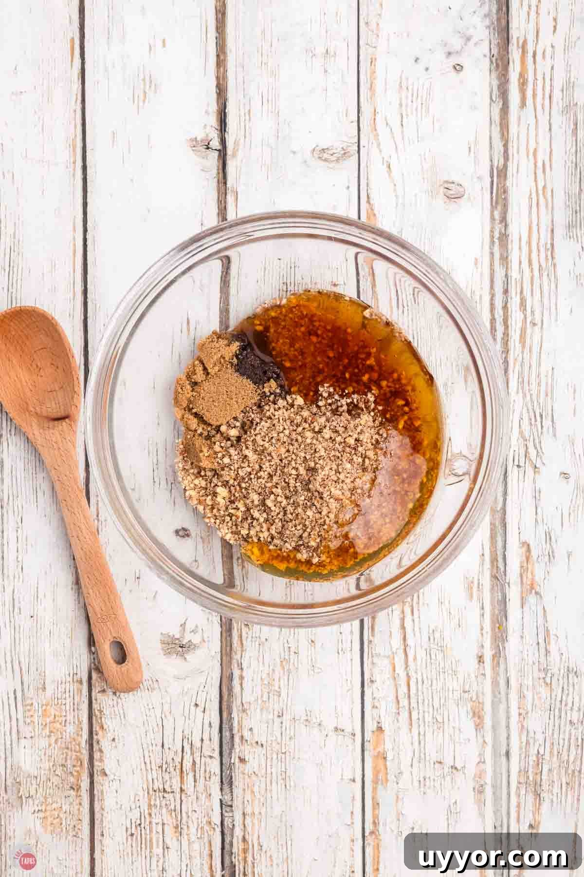 clear bowl of chopped pecans, honey, and brown sugar