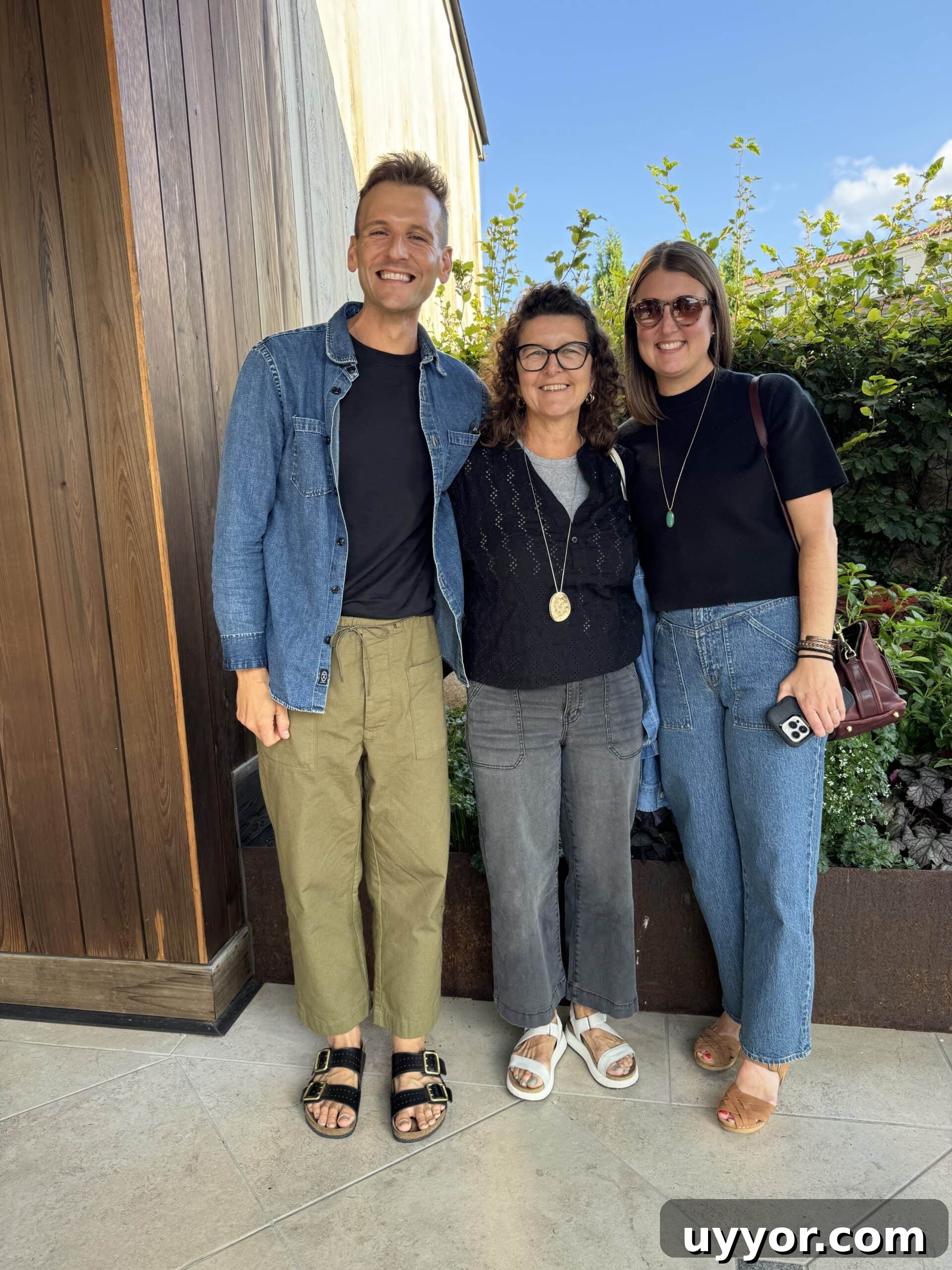August 2024 Events, Deals & Planning Guide 8 Kaleb Wyse standing in front of restaurant on a trip with his mom and sister.