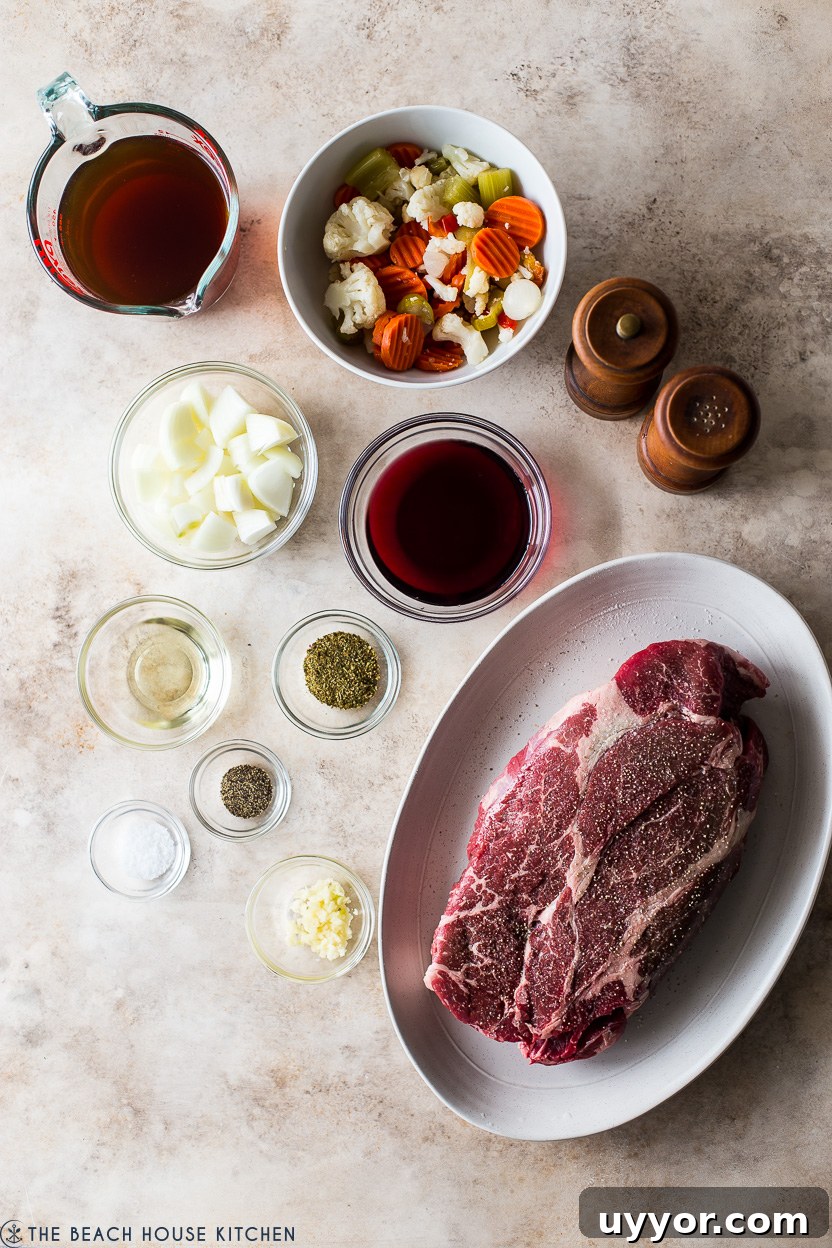 Slow Cooker Italian Beef Sandwiches with Tangy Au Jus 4 Overhead photo of ingredients for Italian beef dish