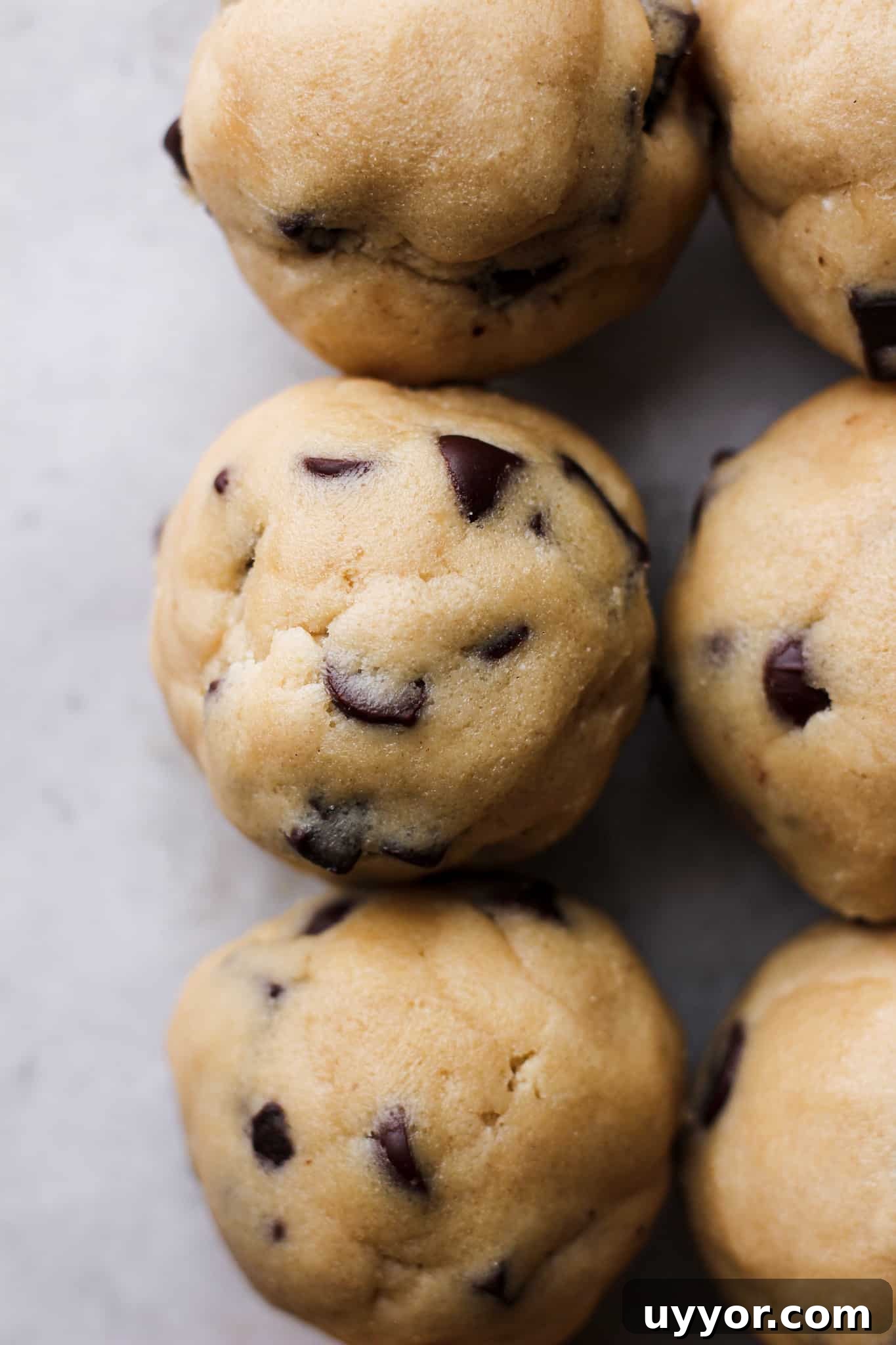 Freeze Cookie Dough and Bake from Frozen: Step-by-Step Guide 5 close up of cookie dough balls with chocolate chips