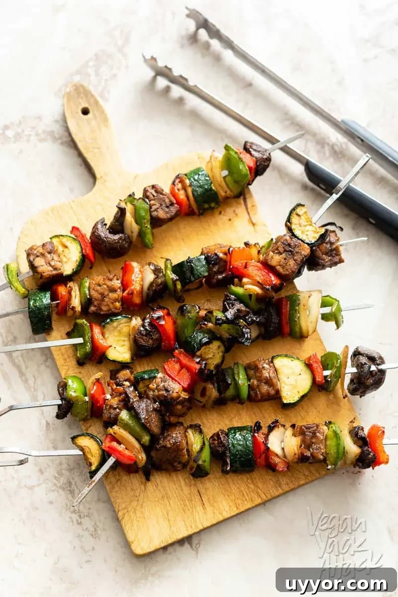 Marinated Tempeh Veggie Skewers on a bread board