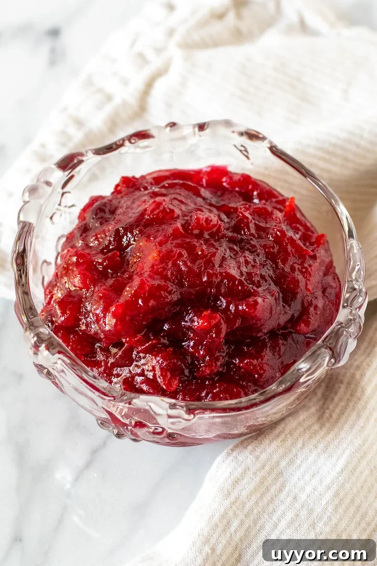 Cranberry Orange Sauce Recipe for Holiday Feasts 7 Cranberry sauce in glass dish.
