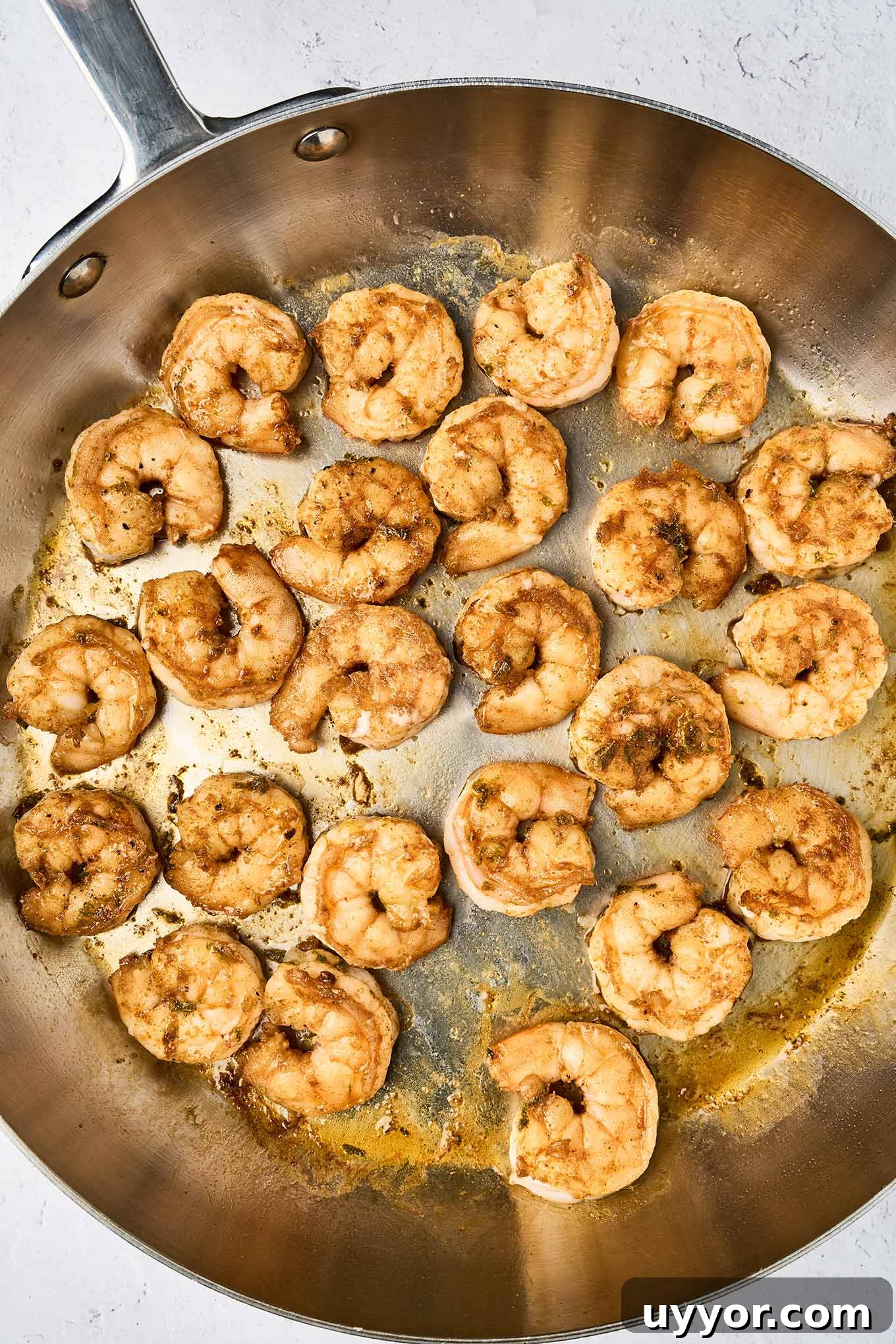 Spicy Shrimp Tacos with Caramelized Sweet Plantains 5 Spicy pan-seared shrimp cooked in a stainless steel skillet, seasoned with smoked paprika, cumin, and cayenne for shrimp tacos.