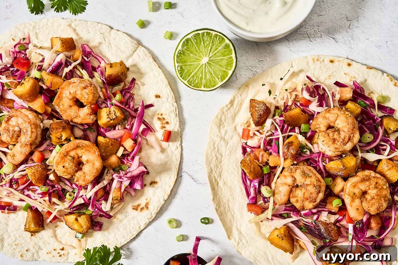 Spicy Shrimp Tacos with Caramelized Sweet Plantains 7 Caribbean-inspired spicy shrimp tacos with sweet plantains, tropical cabbage slaw, and lime crema on flour tortillas.