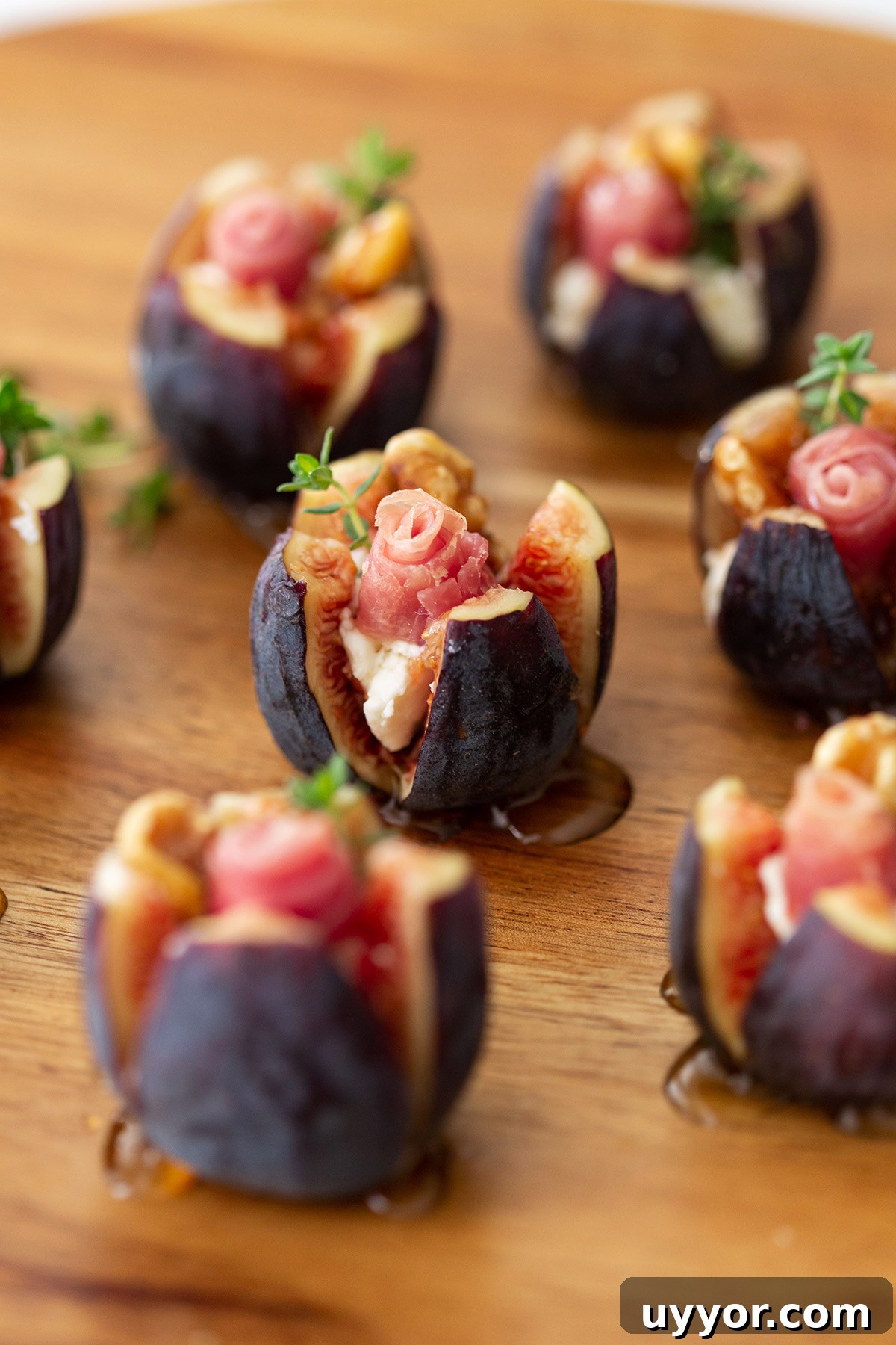 Prosciutto-Wrapped Figs Stuffed with Goat Cheese and Honey 5 Stuffed Figs with Goat Cheese, Prosciutto Roses, and Walnuts
