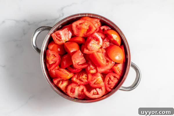 quartered tomatoes ready to cook