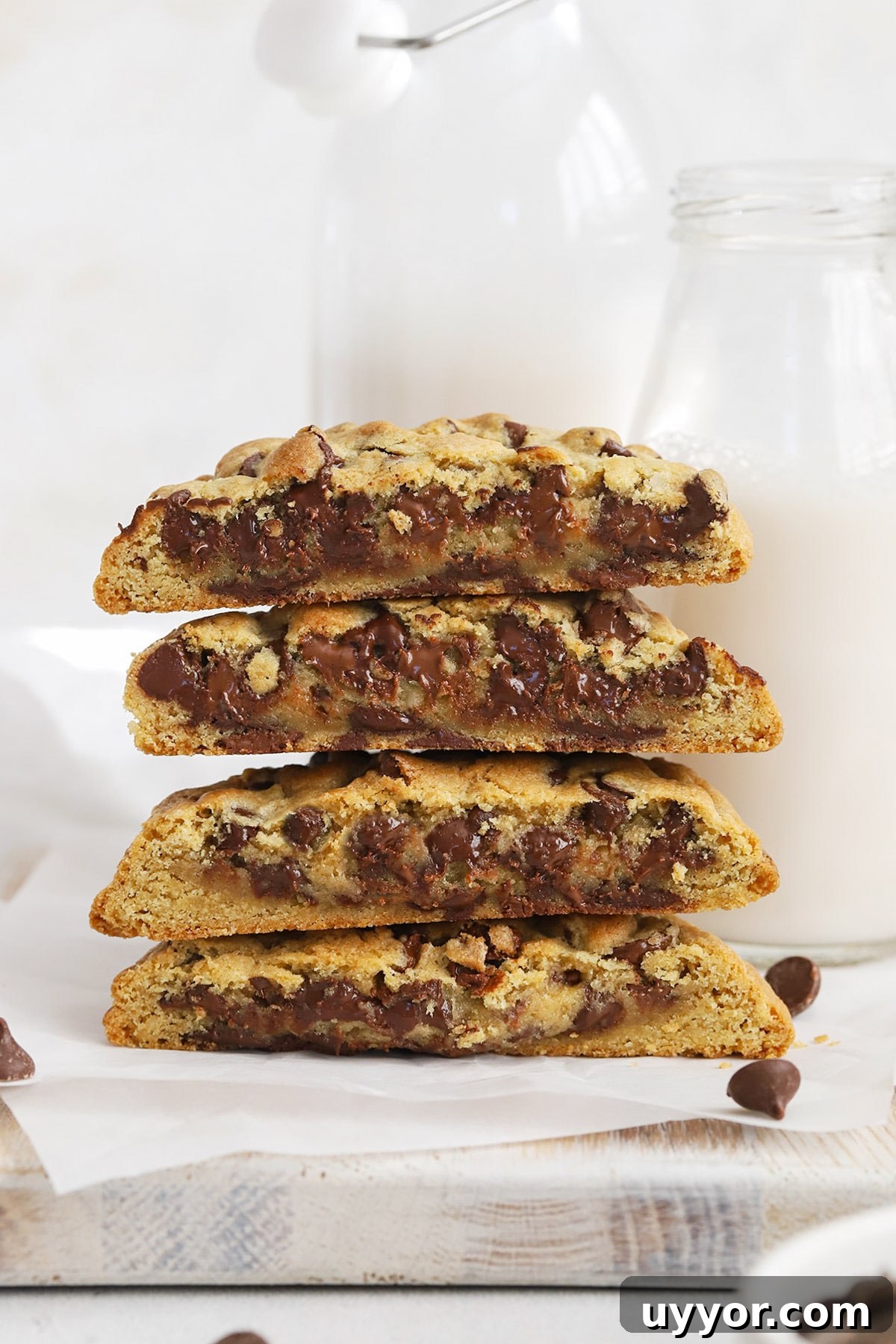 Gluten-Free Levain-Style Chocolate Chip Cookies 8 Front view of gluten-free Levain chocolate chip cookies stacked on top of each other, revealing a gooey middle