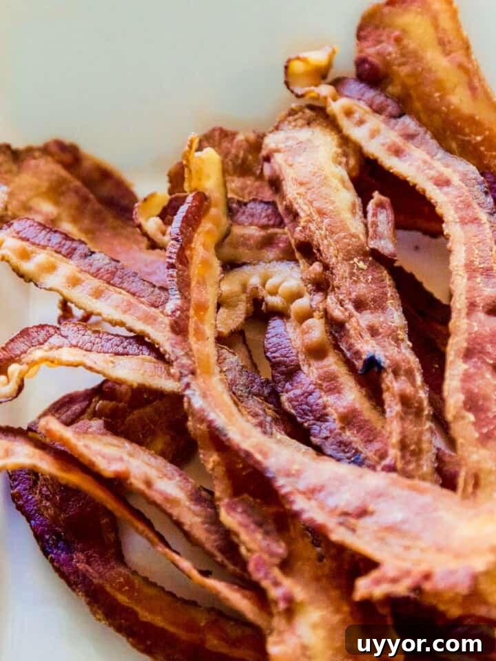 Savory Mini Cheese Truffles: Bite-Sized Party Cheese Balls 6 A pile of crisp bacon strips