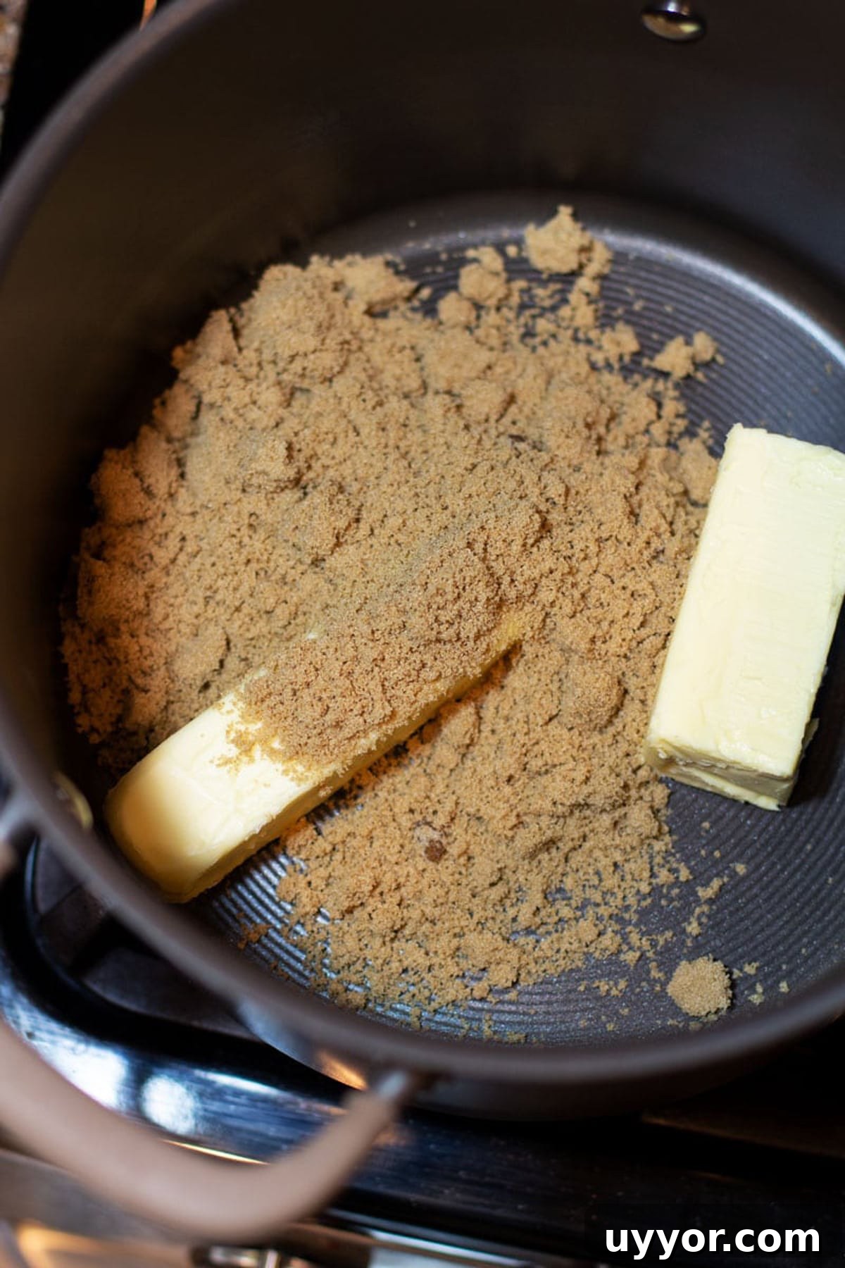 Halloween Crack Candy Recipe: Sweet & Crunchy Toffee Treat 7 Pot containing brown sugar, margarine and butter for making a homemade caramel sauce.