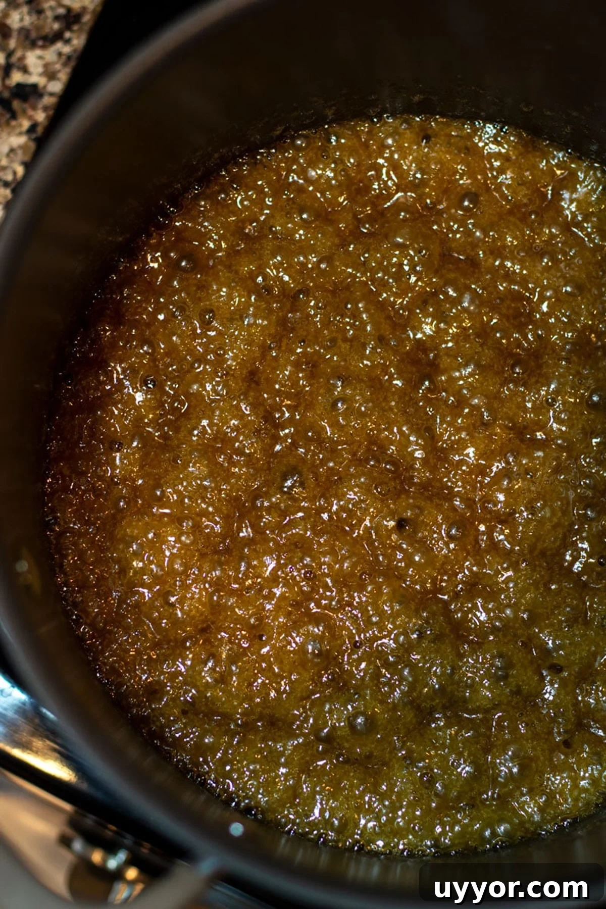 Halloween Crack Candy Recipe: Sweet & Crunchy Toffee Treat 8 Pot containing boiling caramel sauce.
