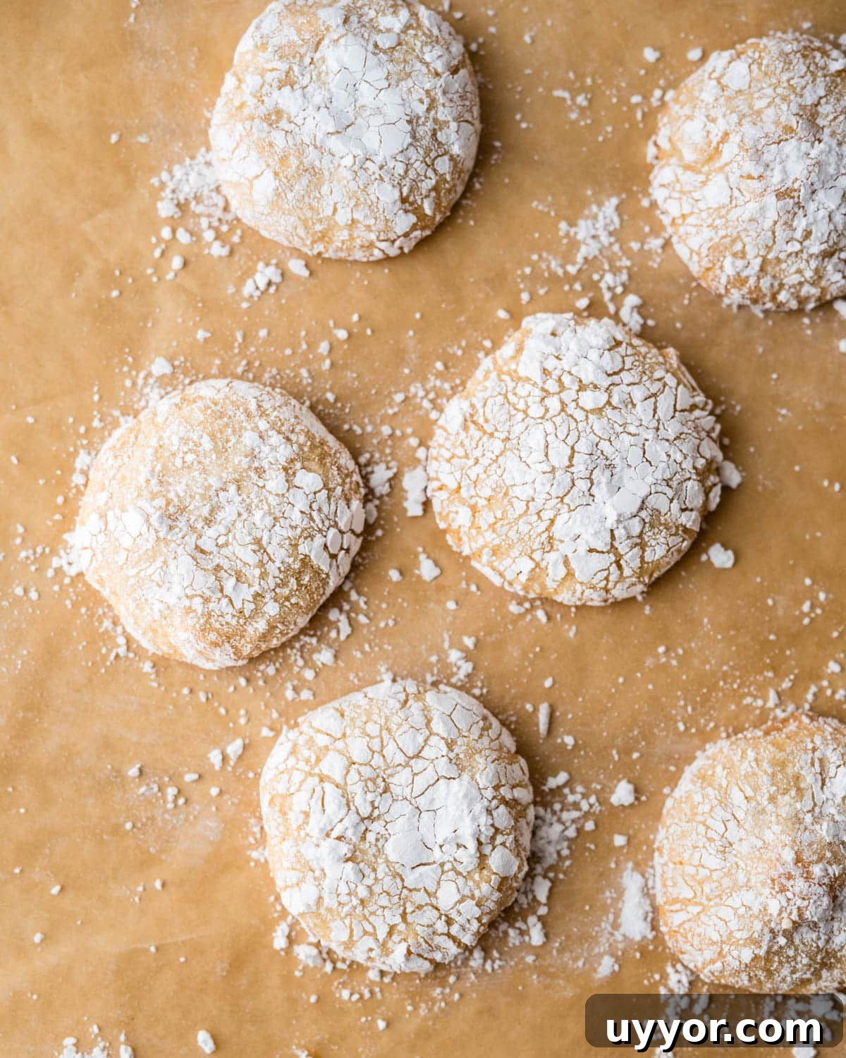 Chewy Ricciarelli: Traditional Italian Almond Cookies 7 Baked ricciarelli on parchment paper.