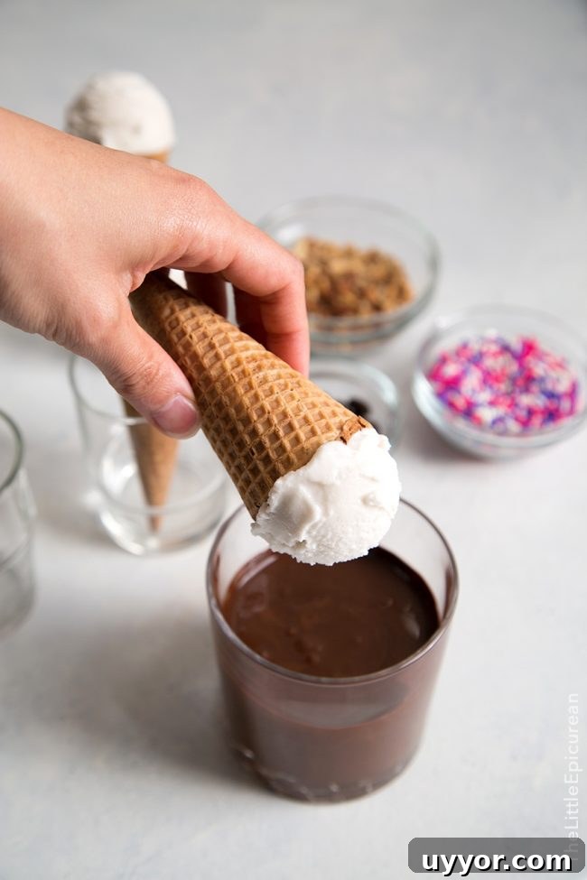 dip coconut ice cream cones int melted chocolate.