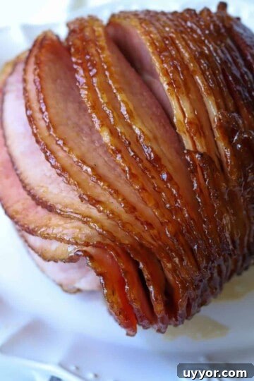 pineapple glazed double smoked ham on white platter