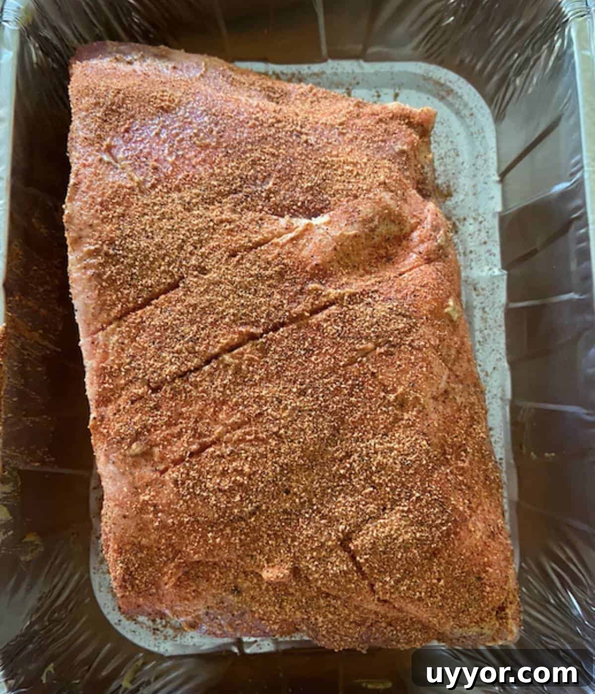 How to Smoke a Pork Butt for Tender, Flavorful Pulled Pork 6 Pork butt coated in dijon mustard then covered with seasoning.