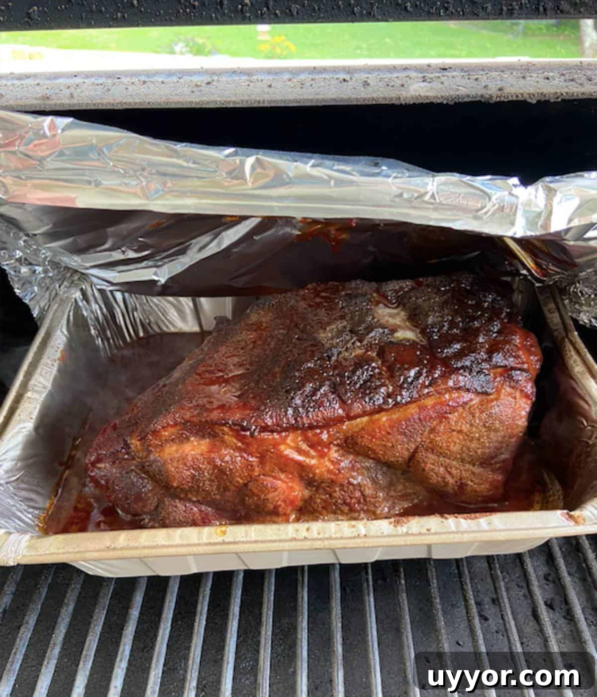 How to Smoke a Pork Butt for Tender, Flavorful Pulled Pork 10 BBQ sauce, brown sugar, and butter added to pork butt in smoker.