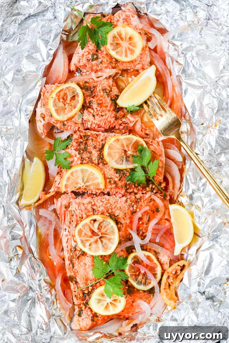 Smoked paprika herb salmon grilled in foil is a flavorful, almost effortless main dish. Season, cook, serve right in the foil. Get this foil grilled salmon recipe on GoodieGodmother.com
