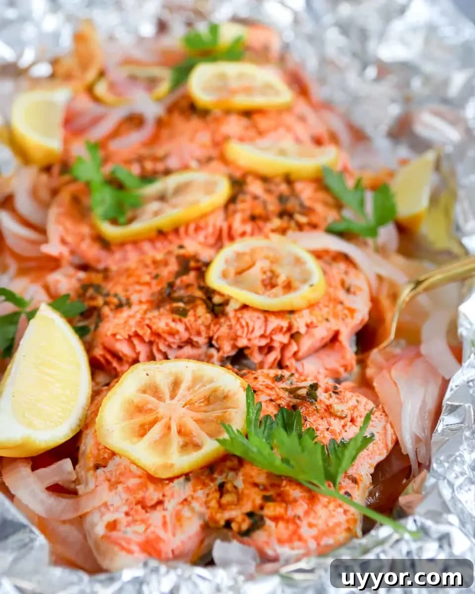 Smoked paprika herb salmon grilled in foil is a flavorful, almost effortless main dish. Season, cook, serve right in the foil. Get this foil grilled salmon recipe on GoodieGodmother.com