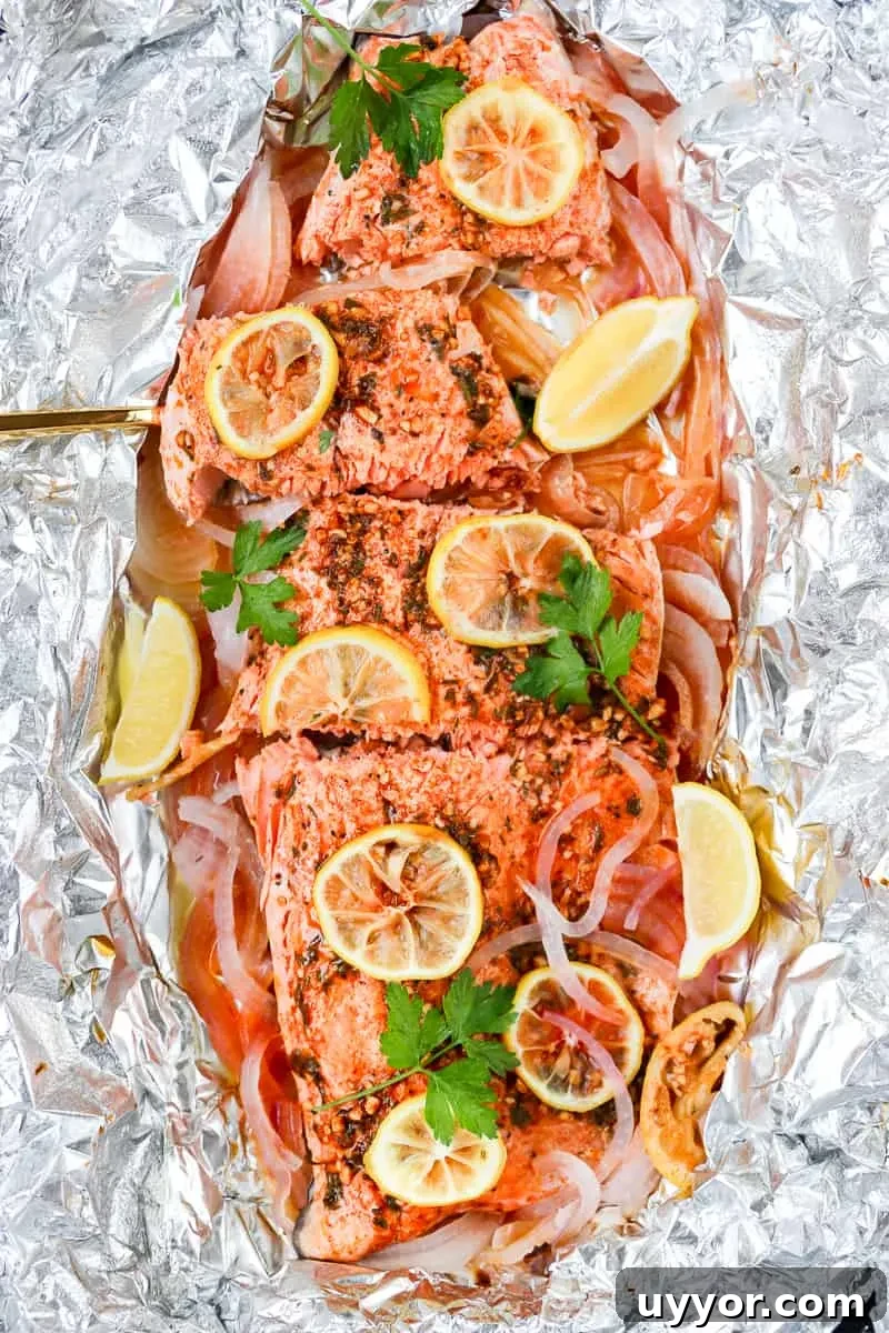 Smoked paprika herb salmon grilled in foil is a flavorful, almost effortless main dish. Season, cook, serve right in the foil. Get this foil grilled salmon recipe on GoodieGodmother.com