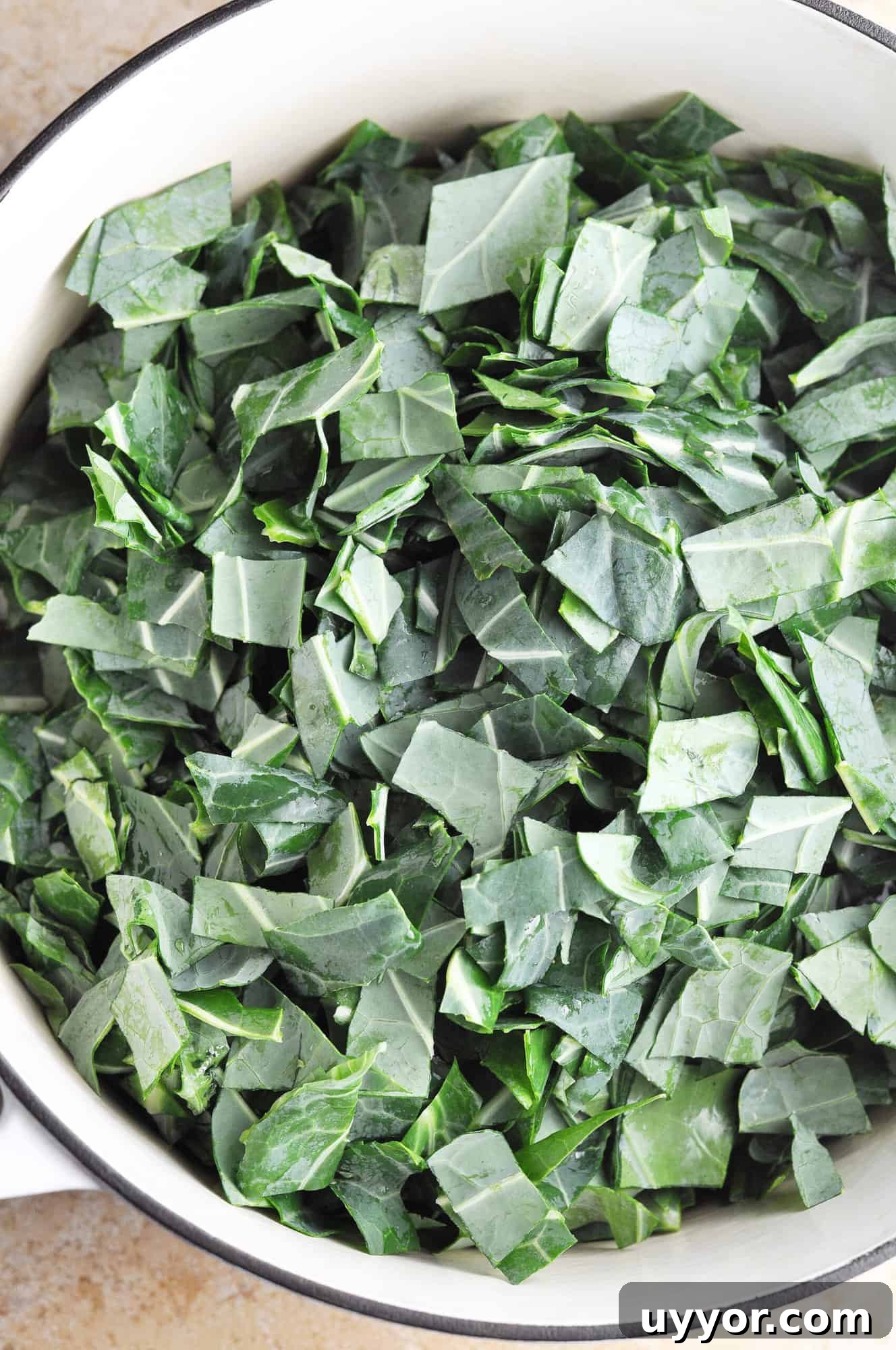 Southern Collard Greens with Ham Hock Recipe for Authentic Flavor 7 Adding collards and stock