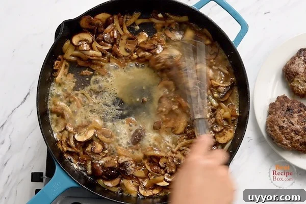 Salisbury Steak with Savory Mushroom and Onion Gravy 7 Whisking in flour and a little broth to the onions and mushrooms