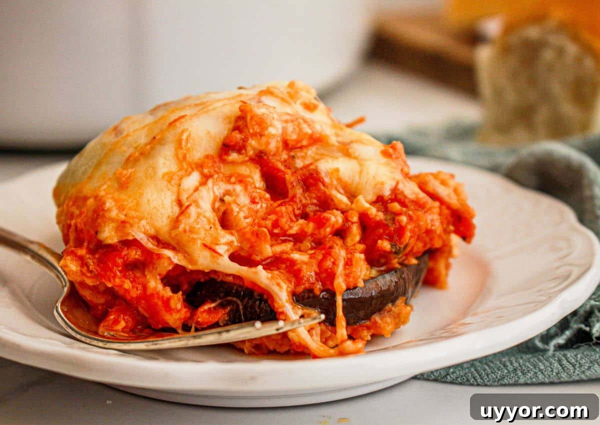 Classic Homemade Eggplant Parmesan Recipe for Crispy Layers 11 Serving of eggplant parmesan on a plate.