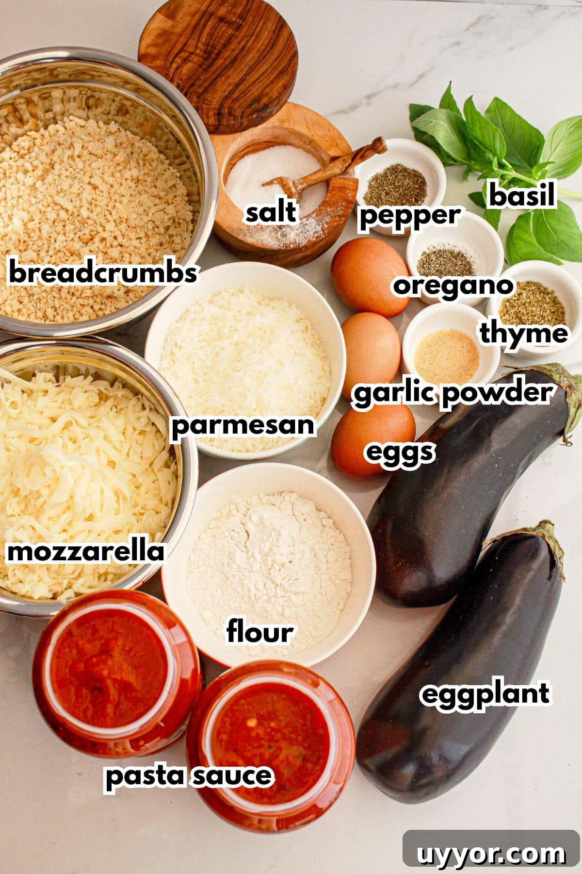 Classic Homemade Eggplant Parmesan Recipe for Crispy Layers 4 Ingredients in bowls on a counter.